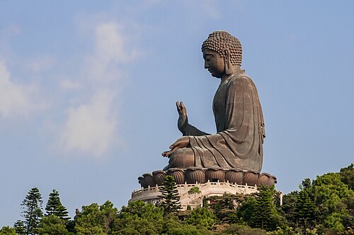 The Tian Tan Big Buddha on Lantau Island beneath a blue sky